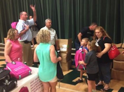 Community Partners Organization Donates Backpacks to HES Students